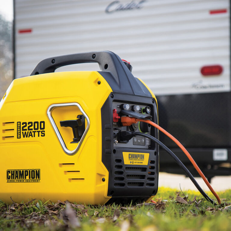 The Mighty Atom' Champion 92001i Inverter Petrol Generator infront of caravan.