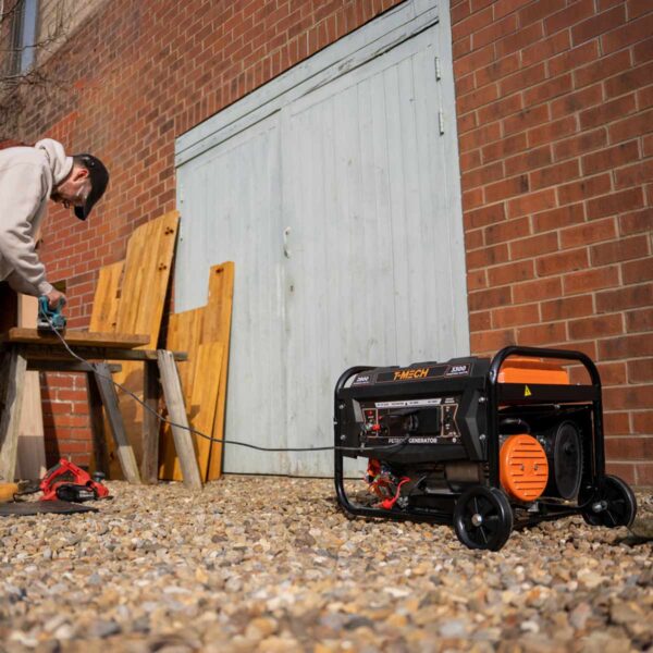 T-Mech-213620-Electric-Start-Petrol-Generator-person-using-generator