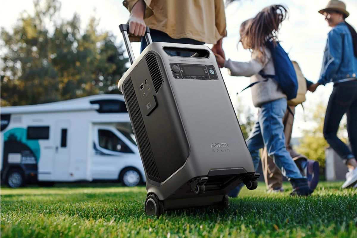 A family heading towards their caravan wheeling the Anker Solix.